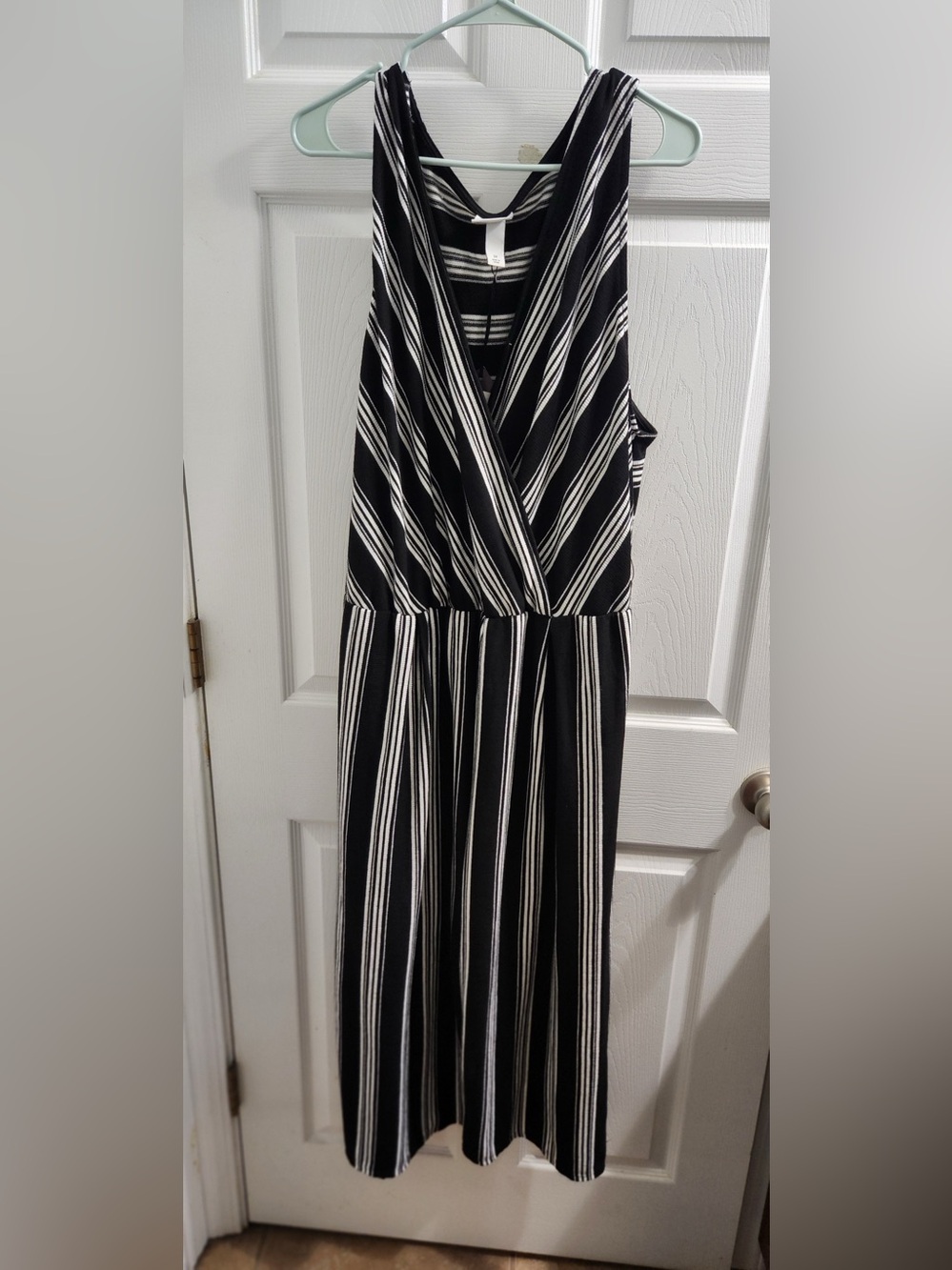 Black and White Striped Sleeveless Wrap jumpsuit.